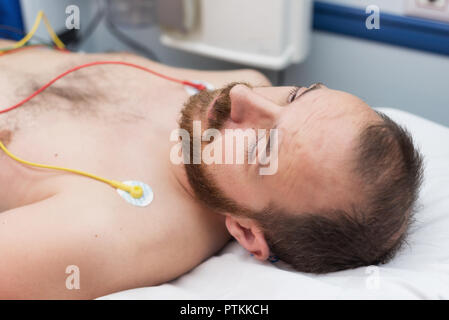 ecg electrodes on patient chest in ambulance Stock Photo