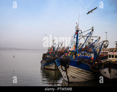 ESSAOUIRA, MOROCCO - CIRCA MAY 2018:  Fishing boats over the port of Essaouria at sunset. Stock Photo