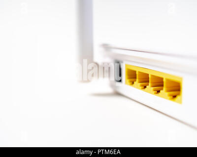 Close-up white wireless WI-FI router internet network hub without patch cables isolated on white background with copy space. Stock Photo