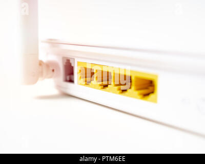 Close-up white wireless WI-FI router internet network hub without patch cables isolated on white background with copy space. Stock Photo