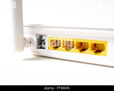 Close-up white wireless internet WI-FI router network hub without patch cables isolated on white background. Stock Photo