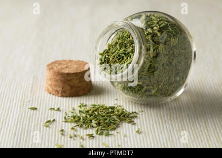 Glass bowl with green anise seeds closeup Stock Photo