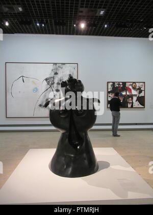 Paris, France. 06th Oct, 2018. The sculpture 'Standing Woman' (front) and the works 'Burnt Canvas II' (right) and 'Painting' by the Catalan artist Joan Miro are shown in the Joan Miro retrospective. It is one of the most extensive exhibitions dedicated to the Catalan artist in France. (to dpa 'Paris shows for the first time again important Joan Miro retrospective' from 10.10.2018) Credit: Sabine Glaubitz/dpa/Alamy Live News Stock Photo