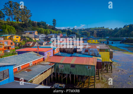 Above beautiful and colorful houses on stilts palafitos in Castro, Chiloe Island Stock Photo