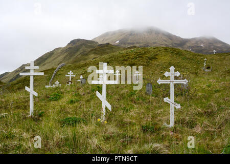 Russian orthodox crosses in a cemetery in the edge of the town of Unalaska, Unalaska Island, Aleutian archipelago, United States Stock Photo