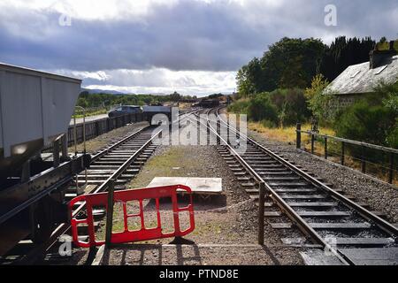 Broomhill, Scotland, United Kingdom. A mainline track and siding of the Strathspey Railway that splices through the Scottish Highlands. Stock Photo