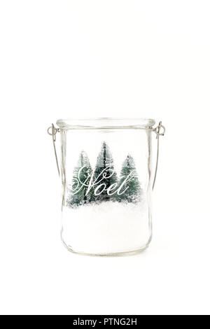 Three mini Christmas trees and snow in mason Glass Jar with metal handle. DIY. Handmade. Stock Photo