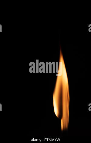 Match with strongly flaring flame on a black background closeup Stock Photo