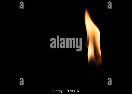 Match with strongly flaring flame on a black background closeup Stock Photo