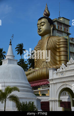 The colourful temple of Wewurukannala Vihara, 2 miles north of Dikwella, home to the largest seated Buddha in Sri Lanka, Asia. Stock Photo