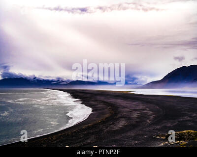 Scenic view of a black sand beach along the Ring Road in Iceland Stock Photo