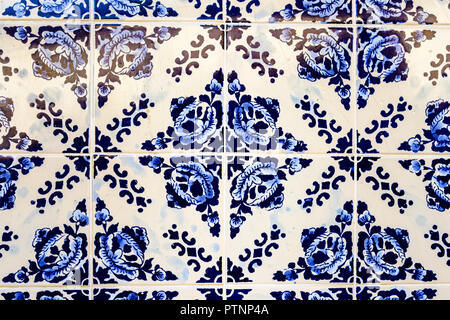 Traditional decoration of the facade of the house in Porto. Typical Portuguese and Spanish ceramic tiles azulejo Stock Photo