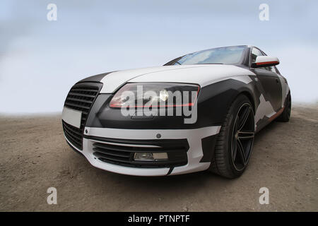 Black and white abstract colored sports car on road Stock Photo