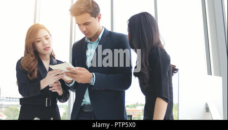 Businessmen and group using notebook for partners discussing documents and ideas in meeting  and business serious for working Stock Photo
