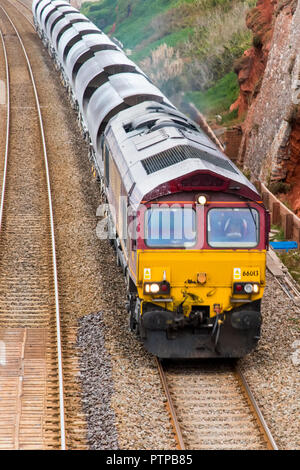 DAWLISH, DEVON, UK - 04OCT2018: DB Cargo UK, Class 66 Diesel Electric Freight Locomotive no 66013 just north of Dawlish Station. Stock Photo