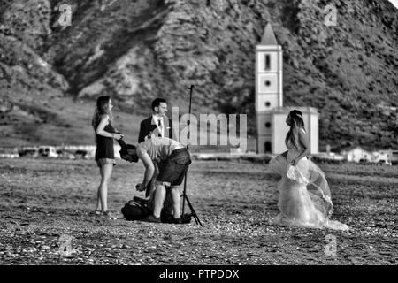 Cabo de Gata, Almeria, Spain- September 22, 2018: Photographer doing photo session for a wedding in Cabo de Gata, Almeria, Spain Stock Photo