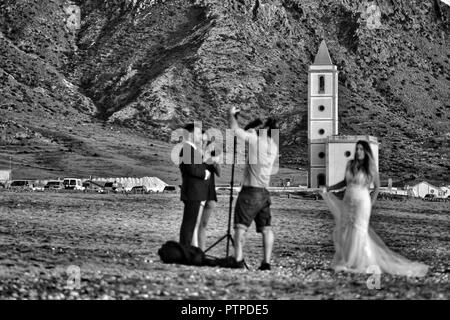 Cabo de Gata, Almeria, Spain- September 22, 2018: Photographer doing photo session for a wedding in Cabo de Gata, Almeria, Spain Stock Photo