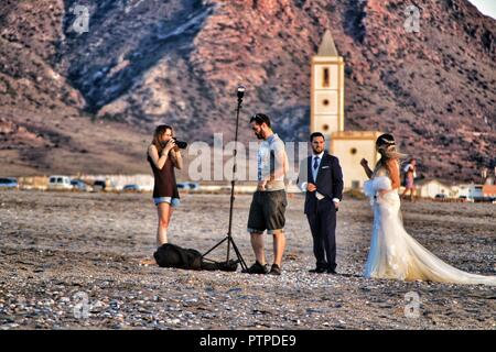 Cabo de Gata, Almeria, Spain- September 22, 2018: Photographer doing photo session for a wedding in Cabo de Gata, Almeria, Spain Stock Photo