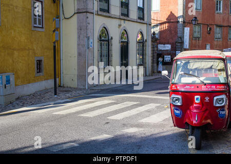 Sintra, Portugal - Circa, September 2018: Tuk tuk taxi vehicle for Tourists Transportation, on street