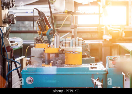 Production of PVC windows, a machine for making holes in the plastic profile of the PVC window, drill Stock Photo