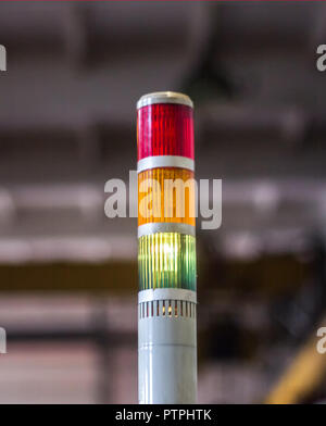 Production traffic light on which the green light is on, close-up, indicator Stock Photo