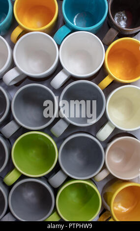 Group of colorful cups on table, closeup top view . Stock Photo