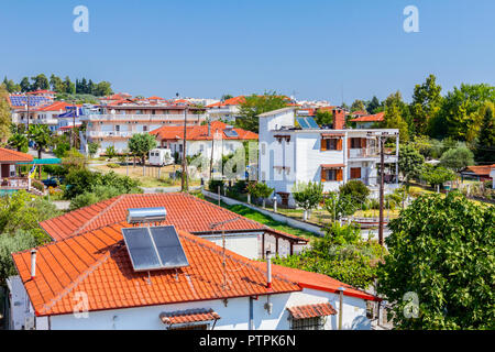 Water panels for using renewable sun energy are placed on house roof, solar hot water system. Modern energy saving technology Stock Photo