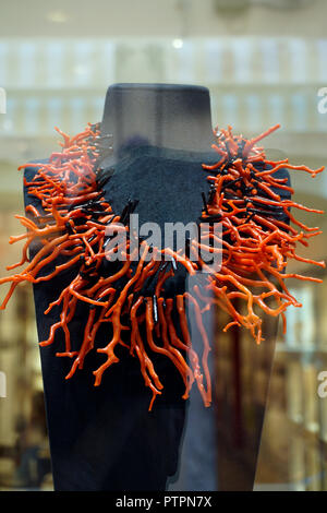 Coral neckless made of red corals behind a shop window, Corso Umberto I, main road and shopping mile of the old town of Taormina, Sicily, Italy Stock Photo
