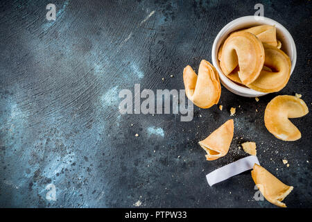 Chinese fortune cookie with prediction on dark blue concrete background  copy space Stock Photo