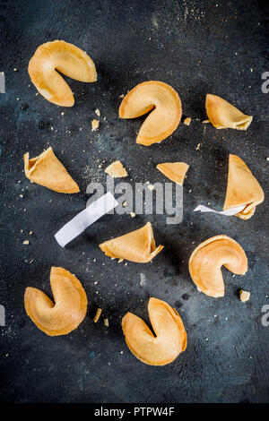 Chinese fortune cookie with prediction on dark blue concrete background  copy space Stock Photo