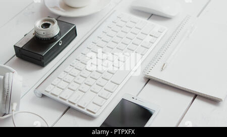 Office gadgets and photo camera Stock Photo