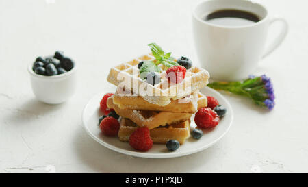 Waffles on plate and cup of coffee Stock Photo