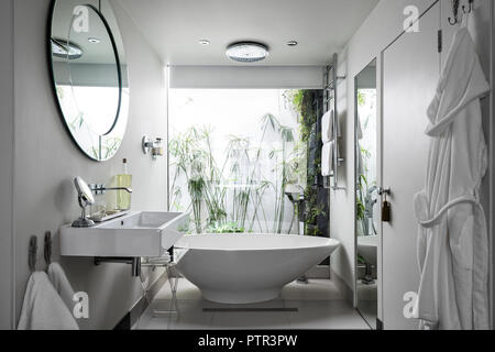 Essence freestanding bath from Pura. in window of en suite bathroom Stock Photo