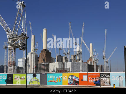 17 tower cranes surround Battersea Power Station in London, during the multi-billion redevelopment of the 42 acre, riverside site. Stock Photo