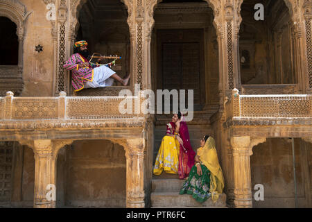 The image of Rajasthani trditional man and woman at Patwaron ki Haveli in Jaisalmer, Rajasthan, India