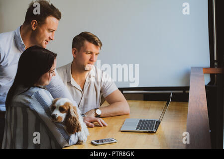 Businesspeople in a co-working space that functions as their office Stock Photo