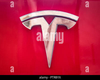 VILNIUS, LITHUANIA-AUGUST 26, 2018: Real Tesla logo on a car red body Stock Photo