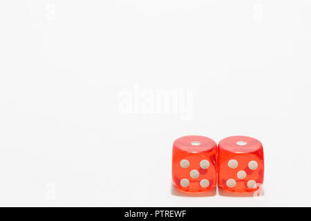 Red dice, typical gambling. With white background and copy space. Stock Photo