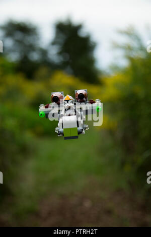 Floating lego star wars spaceship hanging in nature. Stock Photo