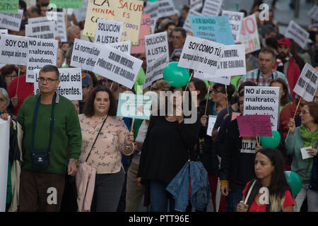 Madrid, Spain. 10th Oct, 2018. Protesters are seen holding posters during the protest.Hundreds of people have protested from Atocha to Puerta Del Sol against the labels that society puts on them on the International Mental Health Day where the Spanish public health system has demanded for an improvement in the matters of Mental Health, the public health system has also criticized the budget cuts in the Mental Health. Credit: Lito Lizana/SOPA Images/ZUMA Wire/Alamy Live News Stock Photo