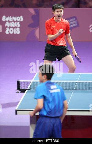 Buenos Aires, Argentina. 10th Oct, 2018. Wang Chuqin of China reacts during the men's singles table tennis gold medal match against Harimoto Tomokazu of Japan at the 2018 Summer Youth Olympic Games in Buenos Aires, Argentina, on Oct. 10, 2018. Wang Chuqin won 4-1. Credit: Li Ming/Xinhua/Alamy Live News Stock Photo
