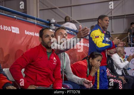 Buenos Aires, Buenos Aires, Argentina. 10th Oct, 2018. Coaches of the two mixed international judo teams finalists in the fourth and last day of judo of the Olympic Games of the Youth Buenos Aires 2018, watch each of the matches of their selections attentive. Credit: Roberto Almeida Aveledo/ZUMA Wire/Alamy Live News Stock Photo