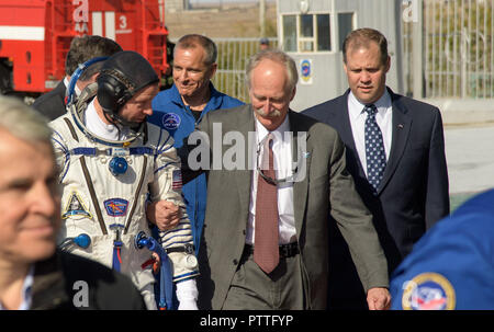 Baikonur, Kazakhstan. 11th October, 2018. Expedition 57 Flight Engineer Nick Hague of NASA, walks with NASA Associate Administrator for the Human Exploration and Operations Directorate William Gerstenmaier, center, and NASA Administrator Jim Bridenstine, right, prior to boarding the Soyuz MS-10 spacecraft for launch from the Baikonur Cosmodrome October 11, 2018 in Baikonur, Kazakhstan. Shortly after lift off the rocket malfunctioned en route to the International Space Station and aborted forcing an emergency landing in Kazakhstan. Credit: Planetpix/Alamy Live News Stock Photo