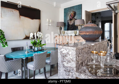 Open plan kitchen and dining room with large artworks Stock Photo