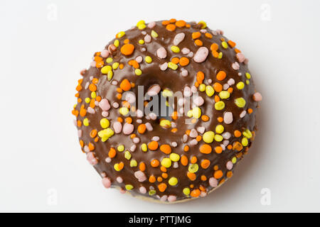 Simple Glazed chocolate Donut on light background. Top view Stock Photo
