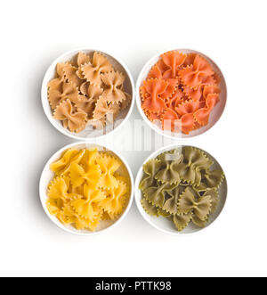 Farfalle pasta. Colorful italian pasta in bowl isolated on white background. Stock Photo