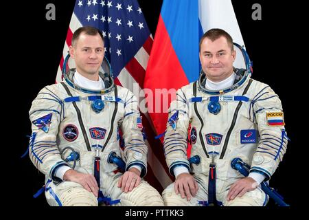 Expedition 57 crew member cosmonaut Alexey Ovchinin of Roscosmos, right, and Nick Hague of NASA portraits in their Sokol launch and entry suits at the Gagarin Cosmonaut Training Center November 16, 2017 in Star City, Russia. International Space Station Expedition 57 crew Nick Hague of NASA and Alexey Ovchinin of Roscosmos are scheduled to launch on October 11th and will spend the next six months living and working aboard the International Space Station. Stock Photo