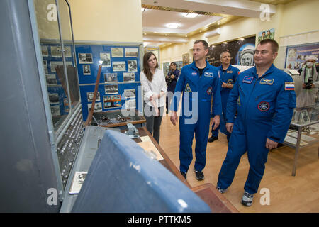 Expedition 57 crew member cosmonaut Alexey Ovchinin of Roscosmos, right, and Nick Hague of NASA take a tour of the Baikonur Cosmodrome Museum October 6, 2018 in Baikonur, Kazakhstan. The two are scheduled to launch on October 11th and will spend the next six months living and working aboard the International Space Station. Stock Photo