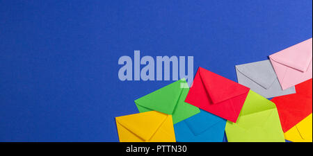 Colorful envelopes on blue background, top view Stock Photo