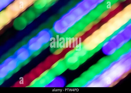 A blurred lines of colored lights on a dark background Stock Photo